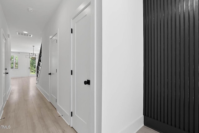 140 E End Ave, Durham, NC 27703 - corridor featuring baseboards and a chandelier