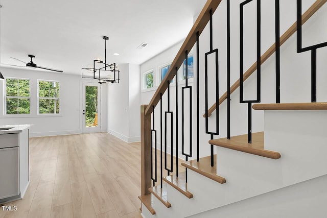 140 E End Ave, Durham, NC 27703 - stairs with a ceiling fan, wood finished floors, recessed lighting, and a chandelier