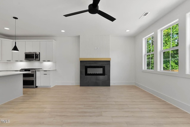 140 E End Ave, Durham, NC 27703 - kitchen featuring stainless steel appliances, light wood finished floors, a ceiling fan, light countertops, and recessed lighting
