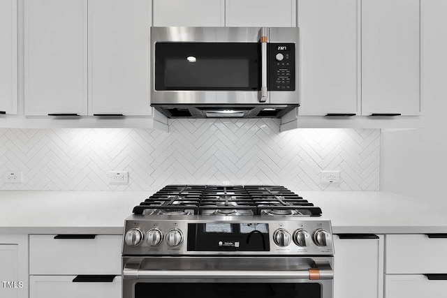 140 E End Ave, Durham, NC 27703 - kitchen with stainless steel appliances, light countertops, white cabinetry, and decorative backsplash