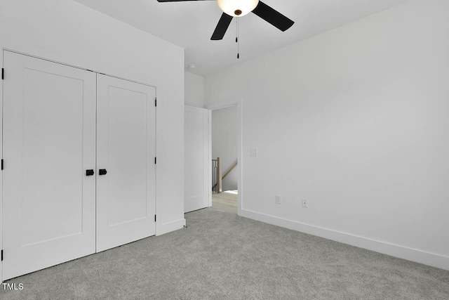 140 E End Ave, Durham, NC 27703 - unfurnished bedroom with carpet floors, a closet, and a ceiling fan