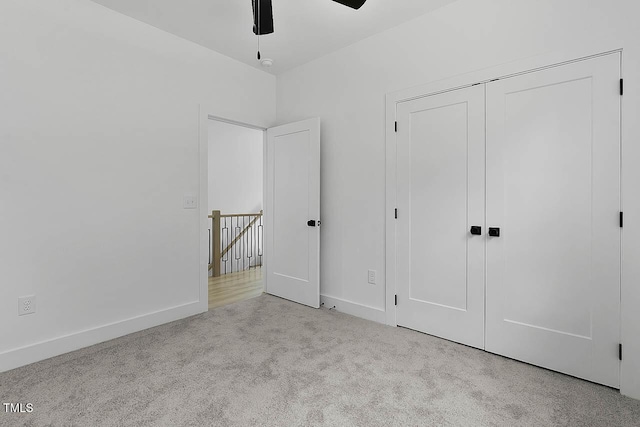 140 E End Ave, Durham, NC 27703 - unfurnished bedroom featuring carpet, a closet, and ceiling fan