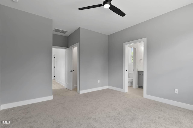 140 E End Ave, Durham, NC 27703 - unfurnished bedroom with light carpet, ensuite bath, and a ceiling fan