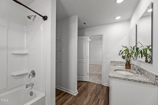 9059 Shallow Creek Trl, Bailey, NC 27807 - bathroom featuring double vanity,  shower combination, wood finished floors, and recessed lighting