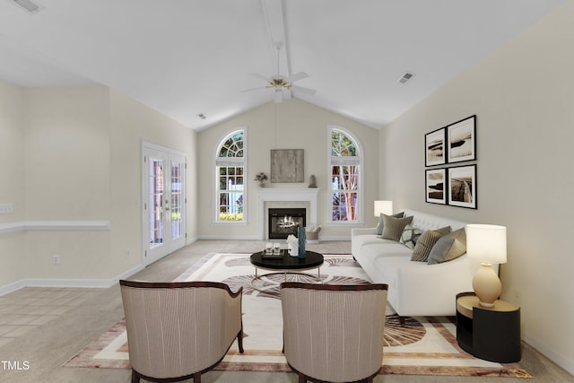 4710 Ludwell Branch Ct, Raleigh, NC 27612 - living area featuring ceiling fan, a glass covered fireplace, light carpet, and high vaulted ceiling