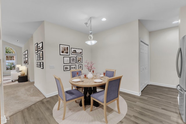 4710 Ludwell Branch Ct, Raleigh, NC 27612 - dining area featuring wood finished floors and recessed lighting