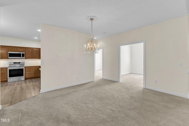 4710 Ludwell Branch Ct, Raleigh, NC 27612 - unfurnished dining area with light carpet, a chandelier, and recessed lighting