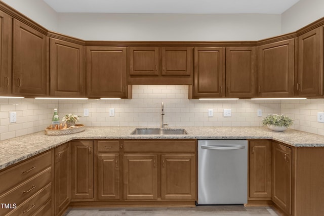 4710 Ludwell Branch Ct, Raleigh, NC 27612 - kitchen featuring dishwasher, backsplash, light stone countertops, and light wood finished floors