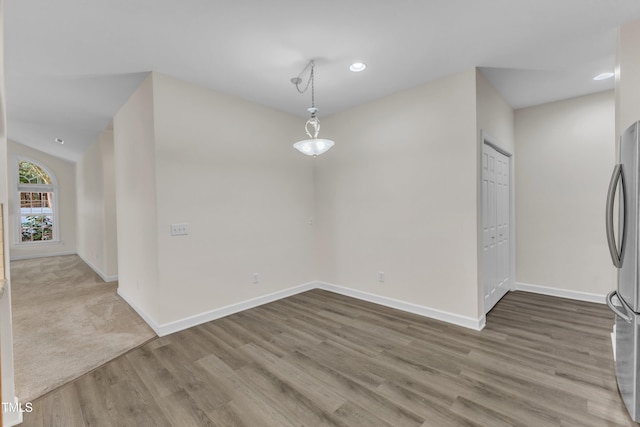 4710 Ludwell Branch Ct, Raleigh, NC 27612 - unfurnished dining area featuring wood finished floors and recessed lighting