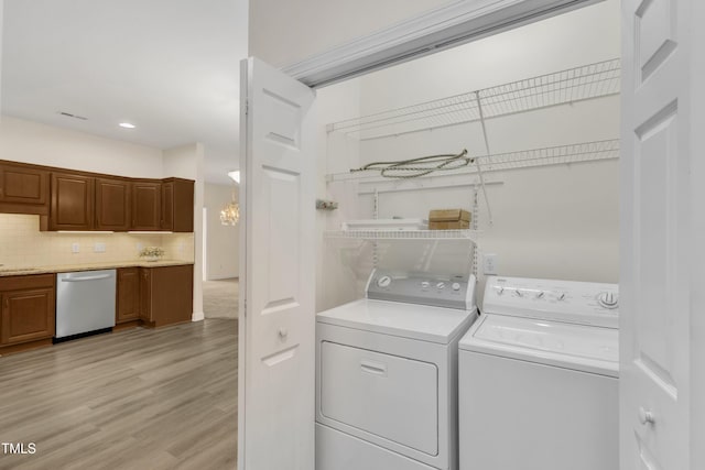 4710 Ludwell Branch Ct, Raleigh, NC 27612 - laundry room with independent washer and dryer, light wood-type flooring, and recessed lighting