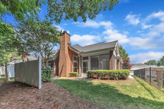 4710 Ludwell Branch Ct, Raleigh, NC 27612 - back of property with brick siding, a chimney, and a shingled roof