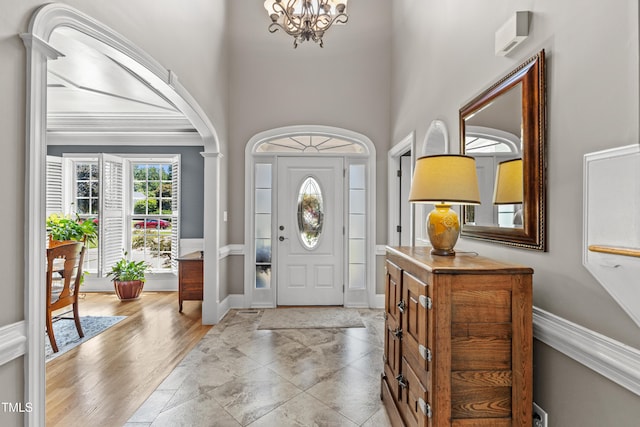 2512 Stewart St, Fuquay Varina, NC 27526 - foyer entrance featuring a chandelier, a high ceiling, and arched walkways