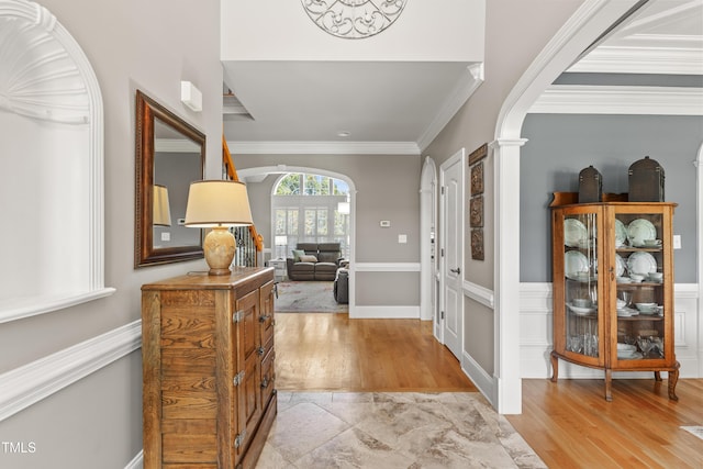 2512 Stewart St, Fuquay Varina, NC 27526 - entryway with arched walkways, crown molding, and light wood-type flooring