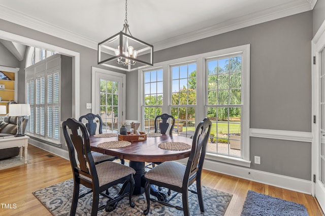 2512 Stewart St, Fuquay Varina, NC 27526 - dining area with a chandelier, wood finished floors, and ornamental molding