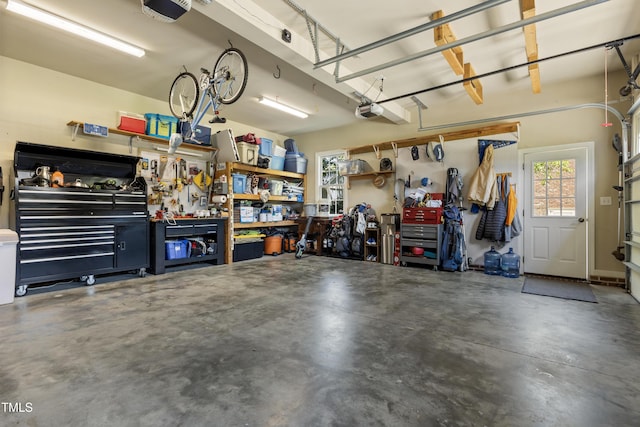 2512 Stewart St, Fuquay Varina, NC 27526 - garage with a workshop area and a garage door opener