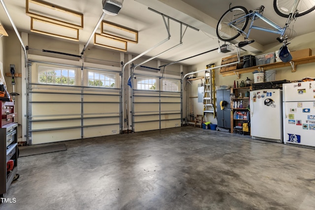 2512 Stewart St, Fuquay Varina, NC 27526 - garage with a garage door opener and freestanding refrigerator