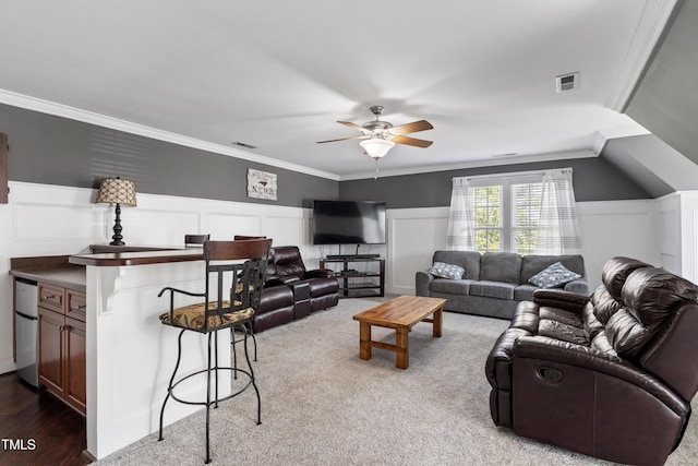 2512 Stewart St, Fuquay Varina, NC 27526 - living area with crown molding, ceiling fan, a decorative wall, carpet, and a wainscoted wall