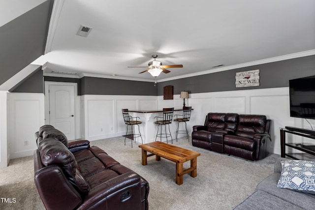 2512 Stewart St, Fuquay Varina, NC 27526 - living area featuring a decorative wall, carpet floors, ceiling fan, a dry bar, and crown molding