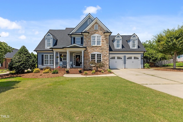 2512 Stewart St, Fuquay Varina, NC 27526 - view of front of home with driveway, a porch, stone siding, an attached garage, and a shingled roof