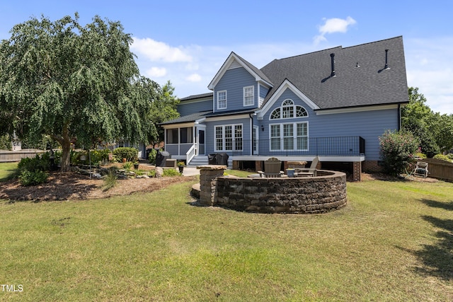 2512 Stewart St, Fuquay Varina, NC 27526 - back of property featuring a yard, a sunroom, roof with shingles, and a wooden deck