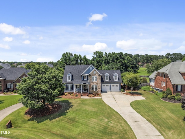 2512 Stewart St, Fuquay Varina, NC 27526 - view of front facade with driveway, an attached garage, a front lawn, and view of wooded area