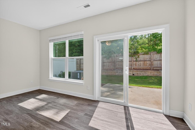 305 Lionel St, Durham, NC 27705 - doorway to outside with dark wood-style floors and baseboards