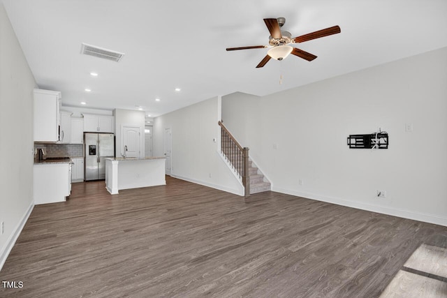 305 Lionel St, Durham, NC 27705 - unfurnished living room featuring stairs, ceiling fan, dark wood-type flooring, and recessed lighting