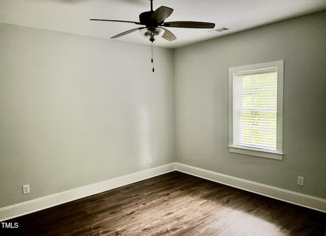622 Williams St, Enfield, NC 27823 - empty room featuring a ceiling fan and dark wood-style floors