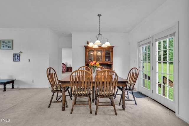 9633 Grassy Creek Rd, Bullock, NC 27507 - dining room featuring crown molding, a chandelier, and light colored carpet