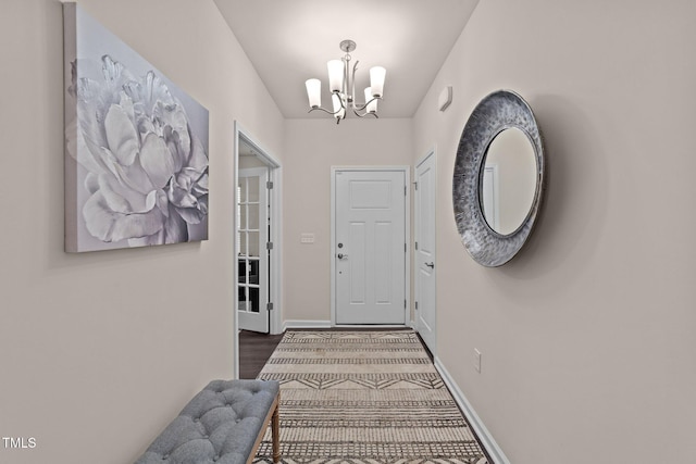 2370 Friars Head Ct, Fuquay Varina, NC 27526 - doorway featuring a chandelier and wood finished floors