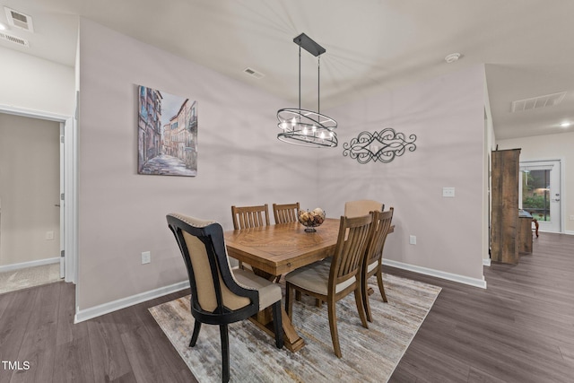 2370 Friars Head Ct, Fuquay Varina, NC 27526 - dining area featuring wood finished floors and a chandelier