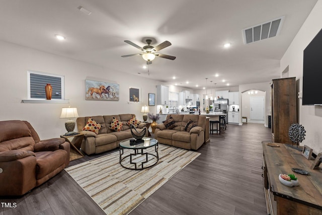 2370 Friars Head Ct, Fuquay Varina, NC 27526 - living area with ceiling fan, arched walkways, recessed lighting, and dark wood-style flooring