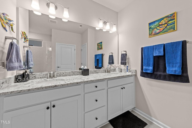 2370 Friars Head Ct, Fuquay Varina, NC 27526 - full bathroom featuring double vanity and a tile shower