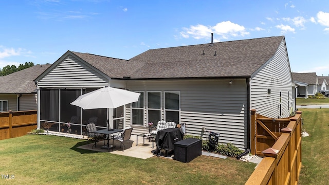 2370 Friars Head Ct, Fuquay Varina, NC 27526 - rear view of house featuring a shingled roof, a patio, and a sunroom