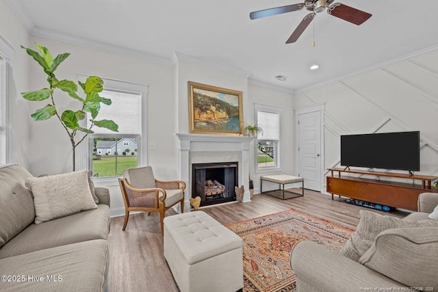 829 Warwick Ln, Carthage, NC 28327 - living area with ornamental molding, wood finished floors, a fireplace, a ceiling fan, and recessed lighting
