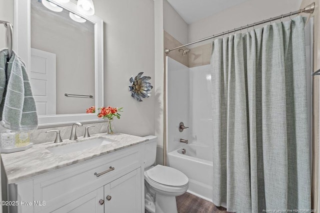 829 Warwick Ln, Carthage, NC 28327 - full bath featuring shower / tub combo, vanity, and wood finished floors