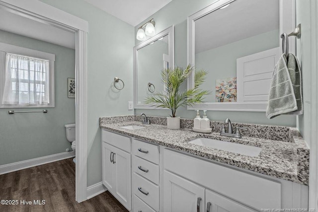 829 Warwick Ln, Carthage, NC 28327 - full bath featuring double vanity and wood finished floors