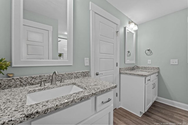 829 Warwick Ln, Carthage, NC 28327 - full bath featuring two vanities and wood finished floors