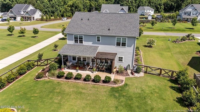 829 Warwick Ln, Carthage, NC 28327 - rear view of house featuring a gate, a patio area, a fenced backyard, roof with shingles, and a residential view
