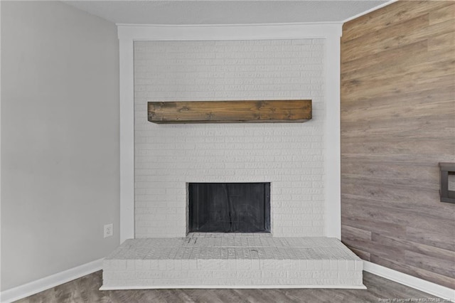 801 Algood Ave, Hope Mills, NC 28348 - detailed view of wood finished floors, a fireplace, and wooden walls
