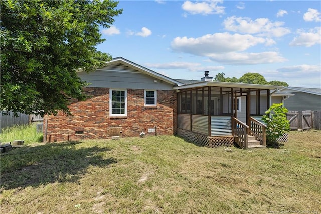 801 Algood Ave, Hope Mills, NC 28348 - rear view of property featuring a sunroom, crawl space, and brick siding