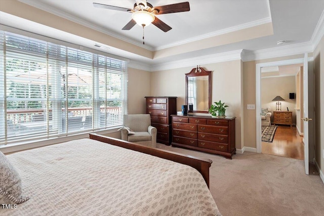 4742 Ludwell Branch Ct, Raleigh, NC 27612 - bedroom with crown molding, light carpet, a raised ceiling, and ceiling fan