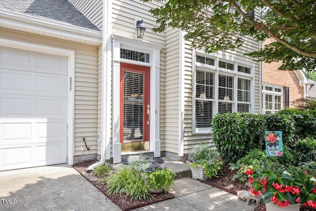 4742 Ludwell Branch Ct, Raleigh, NC 27612 - doorway to property with roof with shingles and an attached garage