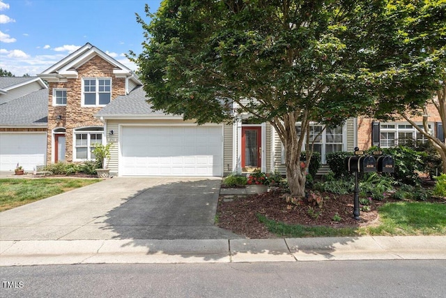 4742 Ludwell Branch Ct, Raleigh, NC 27612 - view of front of home with a garage, stone siding, and driveway