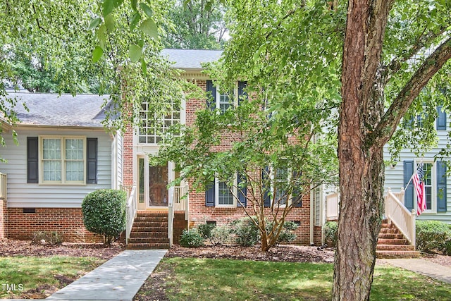 119 Heatherwood Dr, Apex, NC 27502 - view of front of home with a shingled roof, crawl space, and brick siding