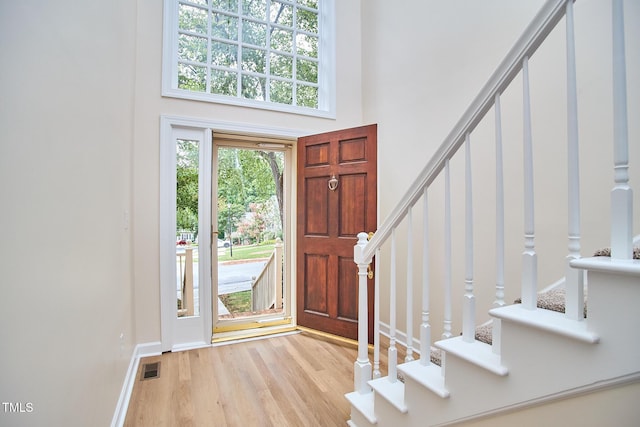 119 Heatherwood Dr, Apex, NC 27502 - entryway with stairway, wood finished floors, and a high ceiling