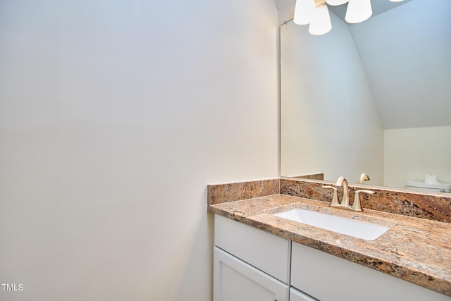 119 Heatherwood Dr, Apex, NC 27502 - bathroom featuring vanity and vaulted ceiling
