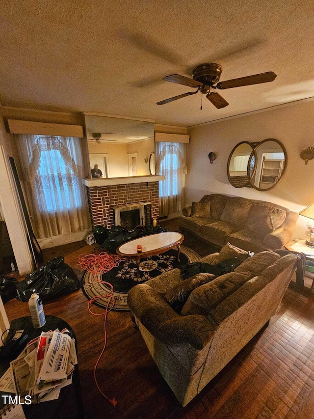 2928 N Patterson Ave, Winston-Salem, NC 27105 - living area featuring hardwood / wood-style flooring, a textured ceiling, healthy amount of natural light, ceiling fan, and a fireplace