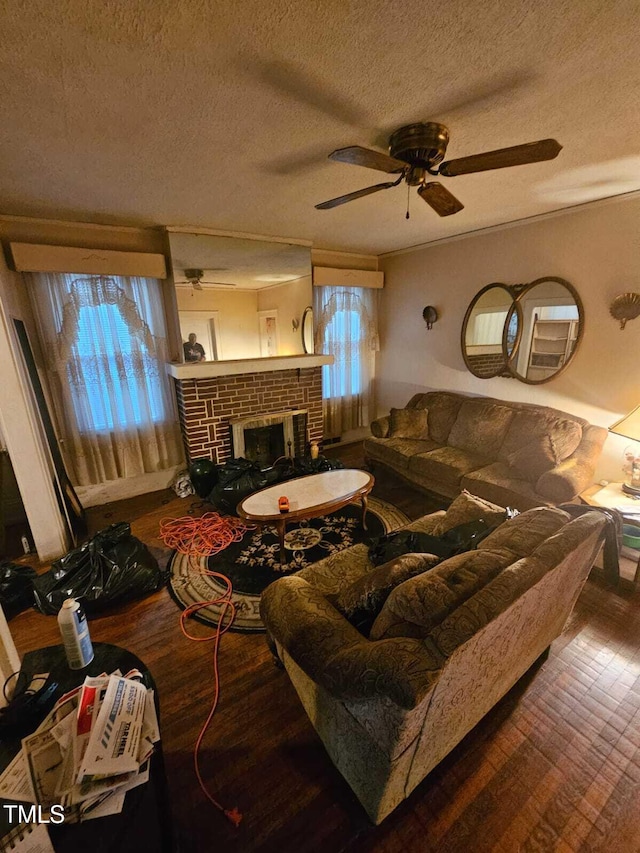 2928 N Patterson Ave, Winston-Salem, NC 27105 - living area with hardwood / wood-style flooring, a textured ceiling, plenty of natural light, ceiling fan, and a brick fireplace