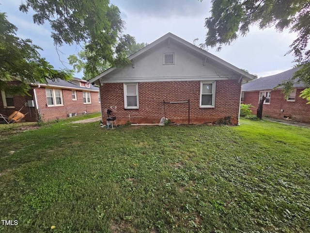 2928 N Patterson Ave, Winston-Salem, NC 27105 - back of property with brick siding and a yard